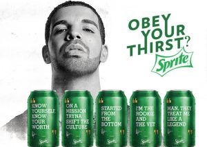 Drake is pictured in a Sprite ad with the slogan "Obey your thirst?" He is seen here next to cans of Sprite that are marketed with his (very profitable) lyrics including "Started from the bottom" and "Know yourself, know your worth". 